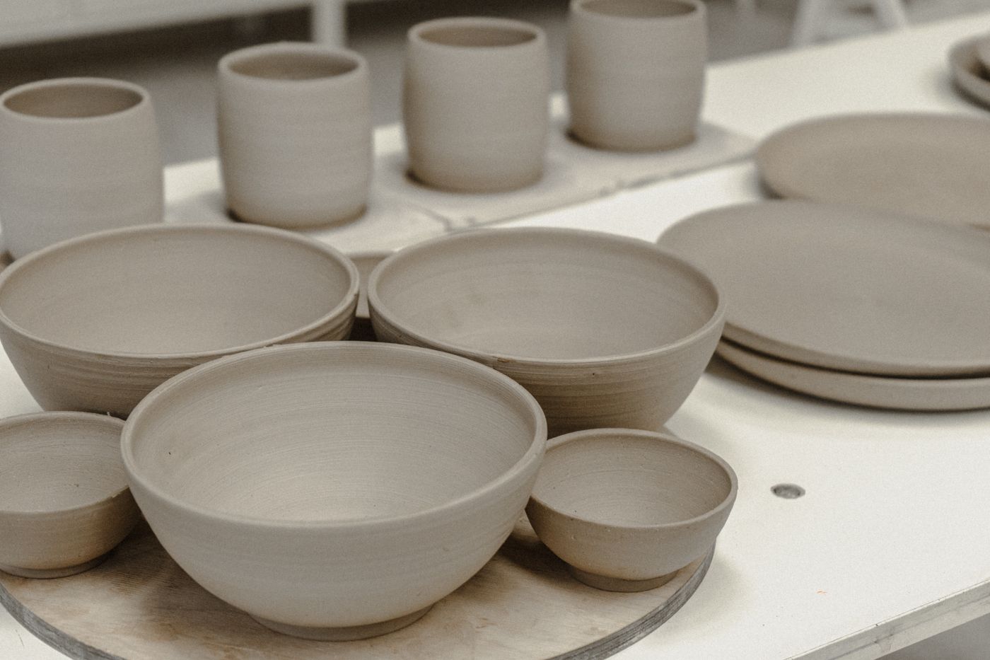Gray clay bowls in a ceramics workshop