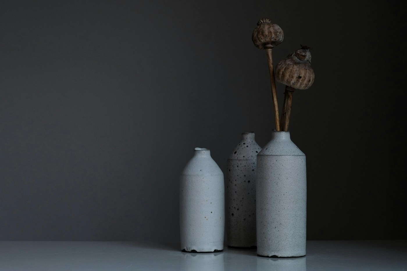 A group of handmade white ceramic vases