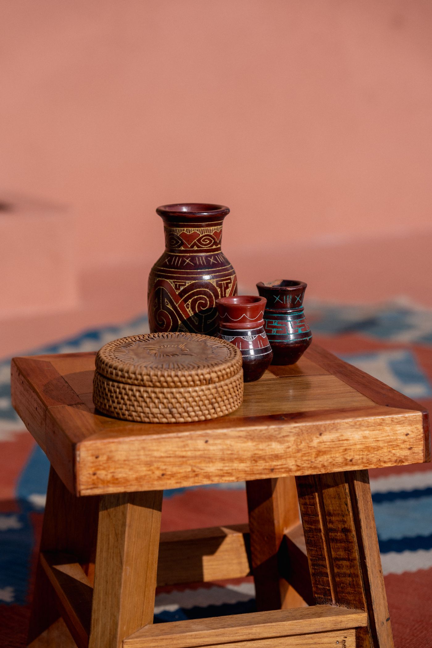A collection of handmade ceramic vessels on a wooden table